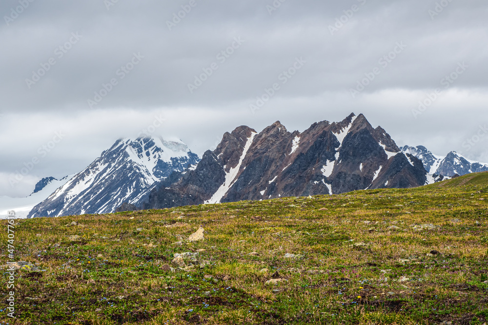 Alpine highlands. Scenic mountain landscape with changeable weather in