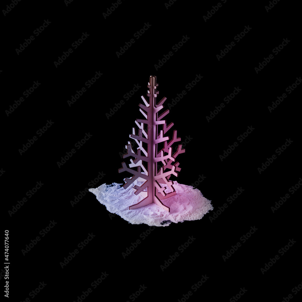 Fototapeta premium Christmas tree with neon colors on dark background. Minimal New Year surrealism.