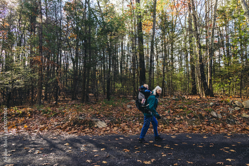 Grandmother hiking with her granddaughter in the woods Grandmother hiking with her granddaughter in the woods