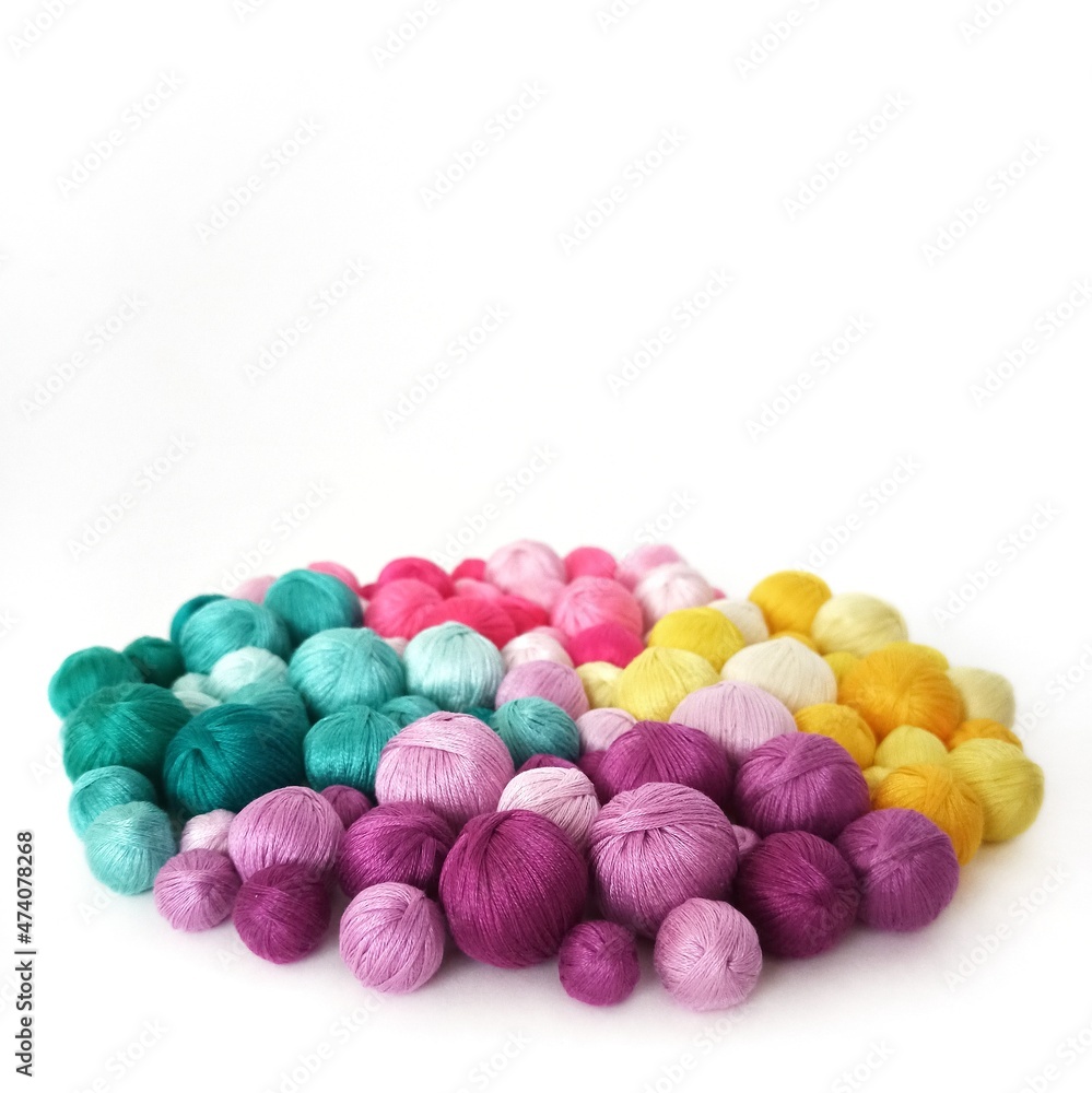 White background. Colored thread, balls of yarn. White background. Colored thread, balls of yarn.