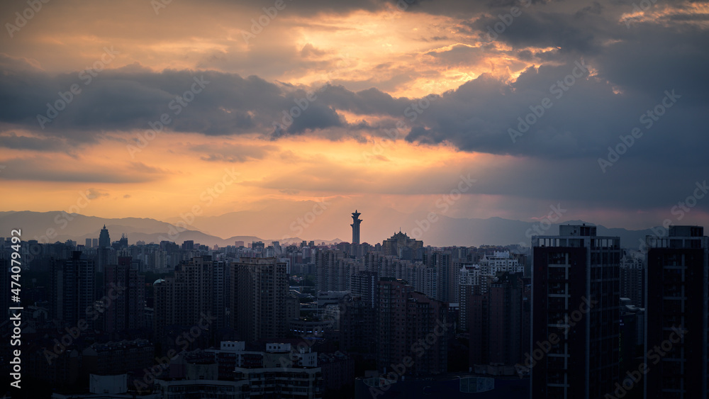 Fototapeta premium sunset over the city and the Beijing olympic tower