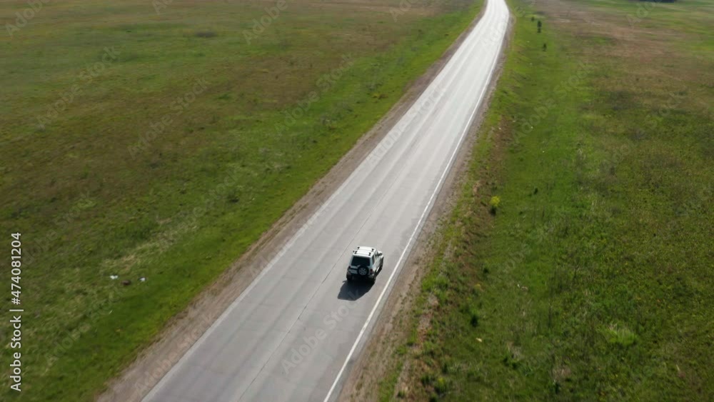 Aerial view of a traveler's car on the road Aerial view of a traveler's car on the road