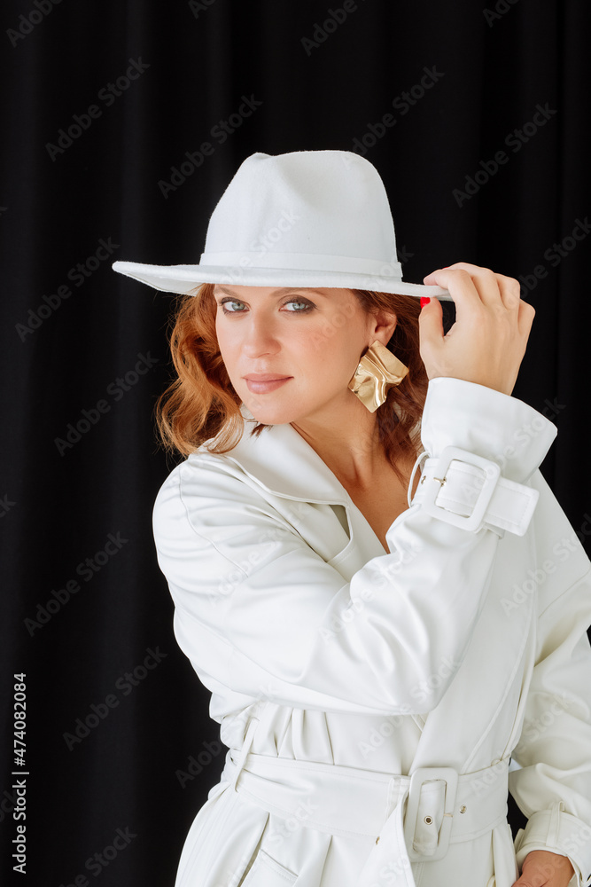A Woman in white coat and hat, minimalist photo A Woman in white coat and hat, minimalist photo