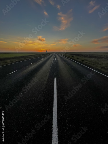 Beautiful look of an infinite road  highway going to a sunset in the Iceland highlands