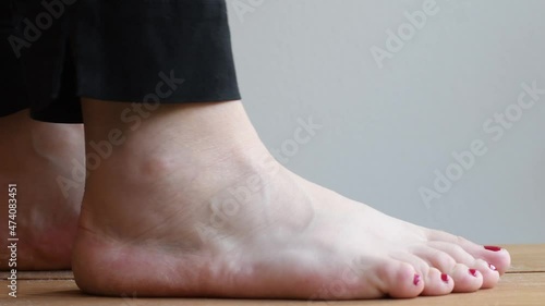 Close-up on a sprained ankle. Person is trying to stretch the swollen foot to see how flexible the foot is during a physiotherapy session.