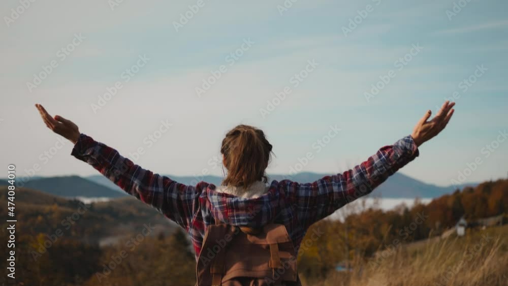 rear view woman hiker backpacker wearing a checkered jacket and hiking ...