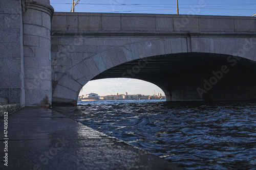 View of St. Petersburg through the arch of the bridge. Neva River. © PuzzleSoul
