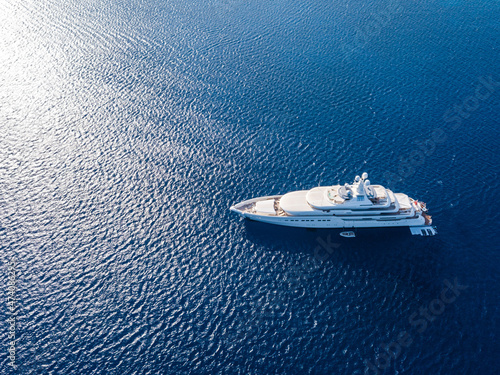 Aerial view on white yacht in blue sea