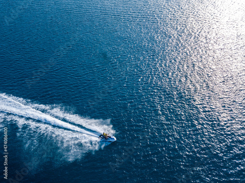 Aerial view on jet ski in azure sea. Water sport