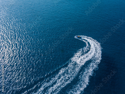 Aerial view on jet ski in azure sea. Water sport © Anton Tolmachov