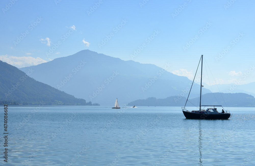 Beautiful view over the lake Zug with boats and the Mount Rigi