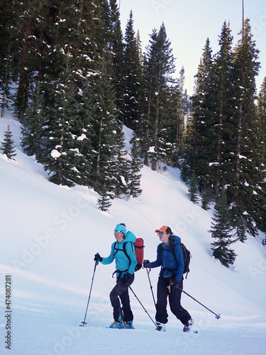 Two women chat on a ski tour in Colorado.