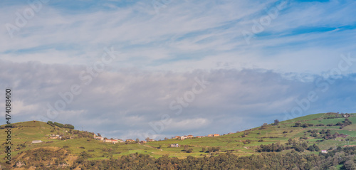 Cantabrian hills and rural landscape of farmland. Valleys pasiegos in nothern Spain. Toned.