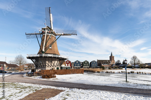 Fototapeta Naklejka Na Ścianę i Meble -  Dutch windmill in the fishing village of Spakenburg in winter.