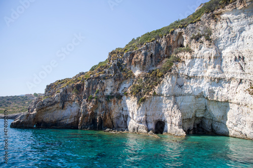 The island with rocky cape and caves © Tetyana
