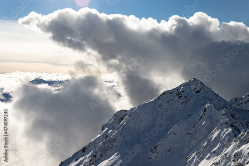 Snowy mountain peak observed from the summit of Weissfluhjoch in the canton of Graubunden, Switzerland photo