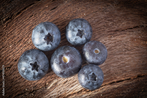 Fresh blueberries on wooden background.