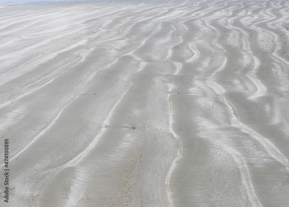 Obraz premium Patterns in the sand at the low tide