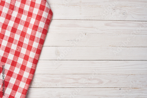 Red checkered tablecloth wooden background texture kitchen decoration