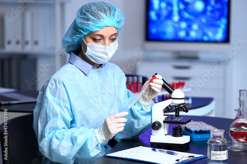 Scientist studying sample i...