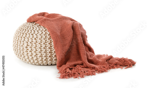 Knitted pouf with plaid on white background