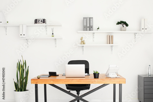 Interior of stylish room with modern workplace © Pixel-Shot