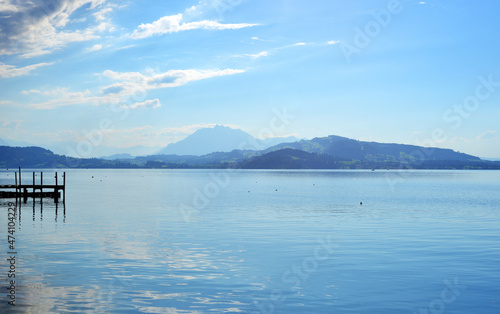 Lake Zug, Switzerland, panoramic view to the alp mountains massive in the distance © Sinuswelle