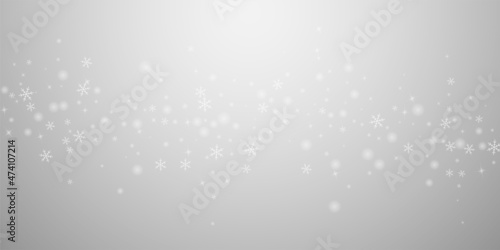 Sparse glowing snow Christmas background. Subtle f