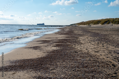 View on white sandy beach, dunes and water of North sea between Vlissingen en Domburg, Zeeland, Netherlands