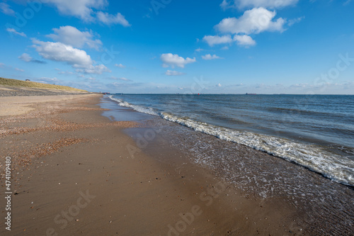 View on white sandy beach, dunes and water of North sea between Vlissingen en Domburg, Zeeland, Netherlands