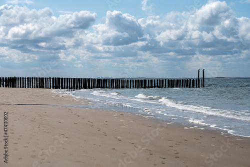 View on wooden poles at white sandy North sea beach near Zoutelande  Zeeland  Netherlands