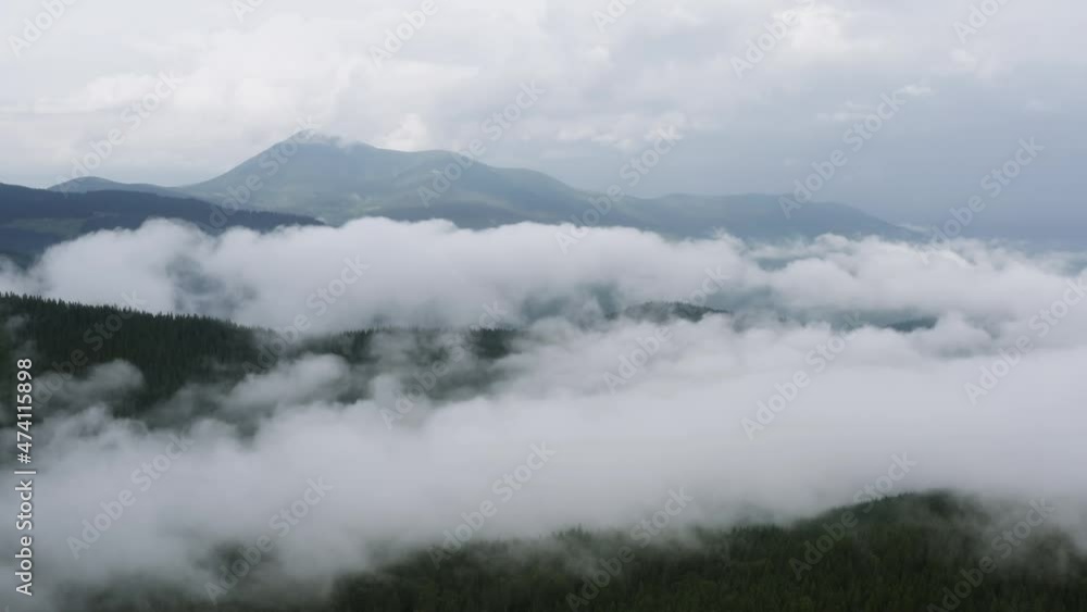 Aerial view of foggy, majestic Carpathian Mountains. Beautiful landscape of untouched nature Aerial view of foggy, majestic Carpathian Mountains. Beautiful landscape of untouched nature
