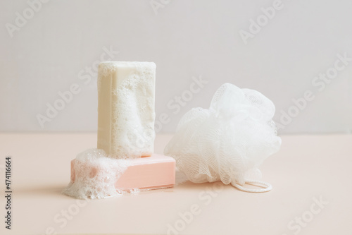Natural organic handmade soap with large bubbles foam washcloth pastel background. Concept of using natural products