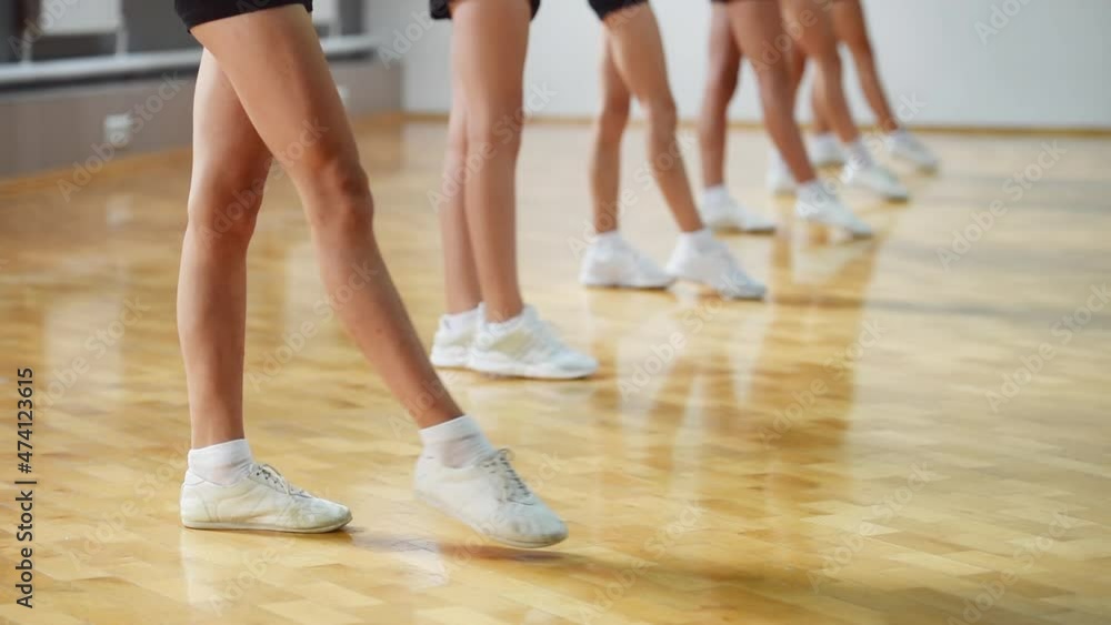 Group of young girls practice fit and light athletic exercises indoors Group of young girls practice fit and light athletic exercises indoors