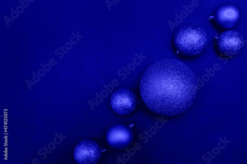 Discreet christmas background  blue christmas balls on blue background