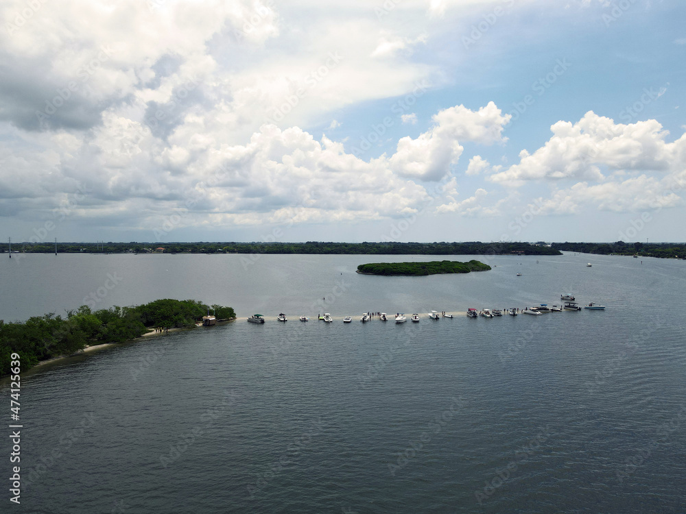 Boats anchored along sand bar on an island in the Atlantic Intracoastal Waterway