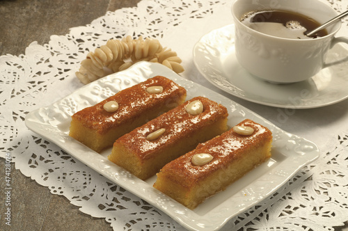 Turkish Dessert Sambali or Damascus Dessert (Sam Tatlisi)/Basbousa Harissa Hareesa- homemade arabic egyptian and lebanese dessert eid ramadan cookies.
 photo