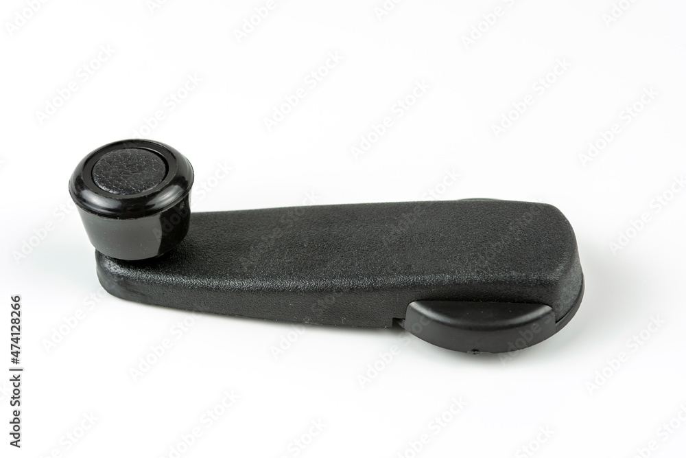 Plastic handle for opening the car window. Spare parts for repair. White background Plastic handle for opening the car window. Spare parts for repair. White background