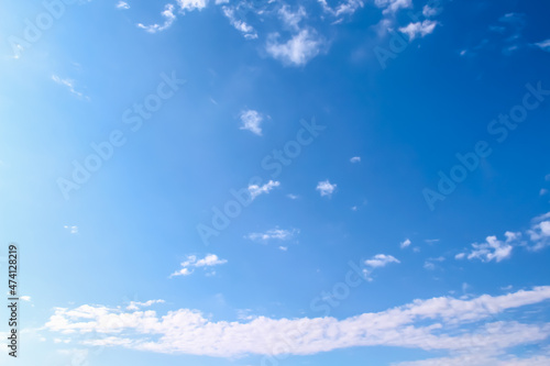 Vast blue clear sky  with white clouds on background
