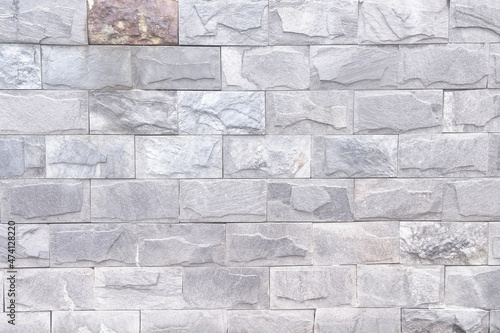 Grey stone plate decorative on wall background
