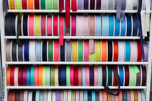 Various ribbons displayed in a traditional market © mnimage