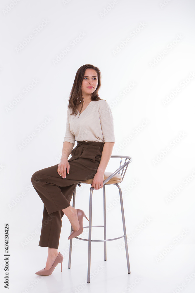 A model with a beautiful makeup in the studio on a white background. professional shooting and lighting in the studio A model with a beautiful makeup in the studio on a white background. professional shooting and lighting in the studio