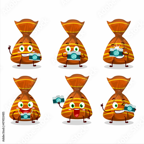 Photographer profession emoticon with orange candy wrappers cartoon character