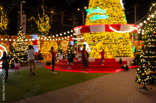 Blur Festival people Christmas abstract background. New year and Christmas party decorations with lights.