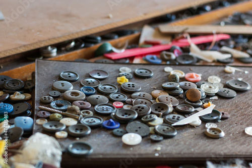 scattered old buttons on the table