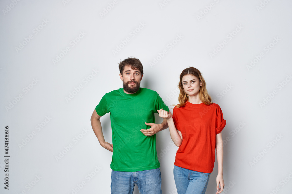married couple multicolored t-shirts communication quarrel studio lifestyle married couple multicolored t-shirts communication quarrel studio lifestyle