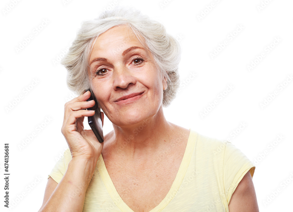 Photo of elderly woman use smartphone over white background Photo of elderly woman use smartphone over white background