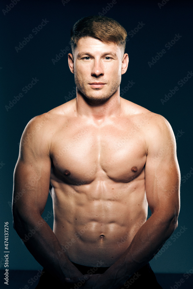 athletic male topless workout muscle bodybuilder dark background athletic male topless workout muscle bodybuilder dark background