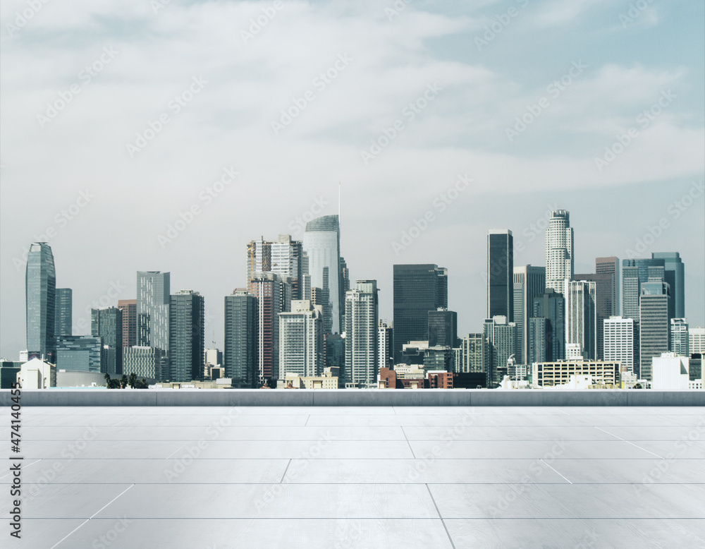 Empty concrete rooftop on the background of a beautiful Los Angeles city skyline at daytime, mock up