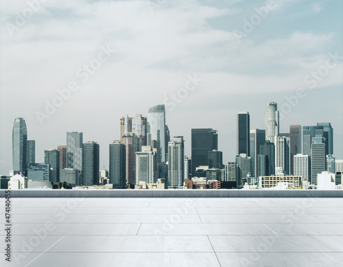 Empty concrete rooftop on the background of a beautiful Los Angeles city skyline at daytime  mock up